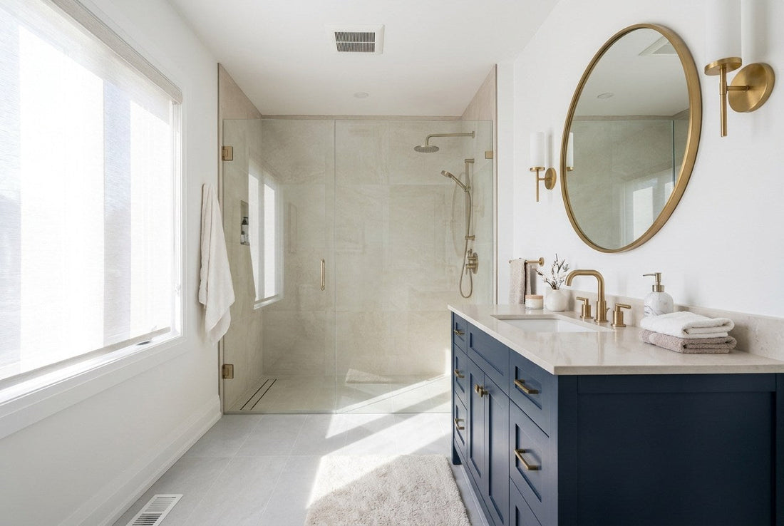 Renovated modern Canadian bathroom with a navy vanity, brass tapware and a frameless walk-in shower
