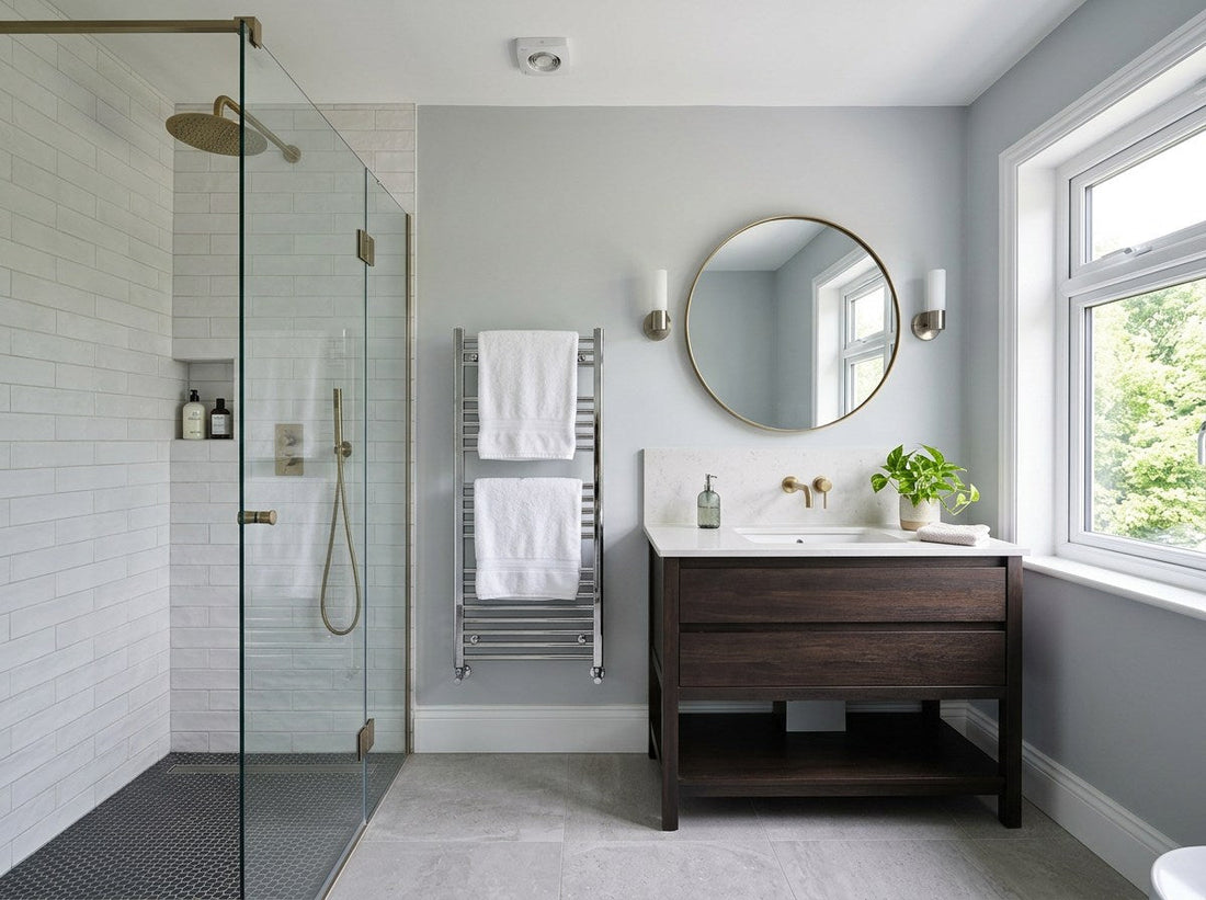 Renovated British bathroom with a tiled shower enclosure, vanity unit and heated towel rail