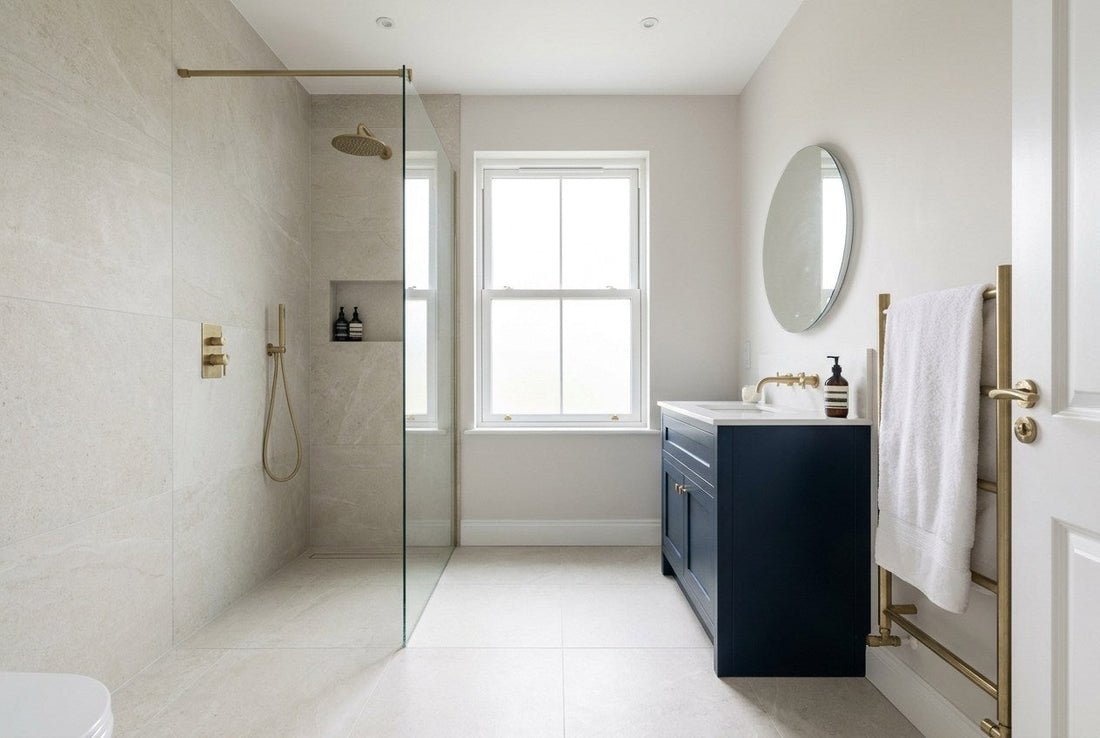 A finished Irish bathroom with a tiled walk-in shower and a navy vanity