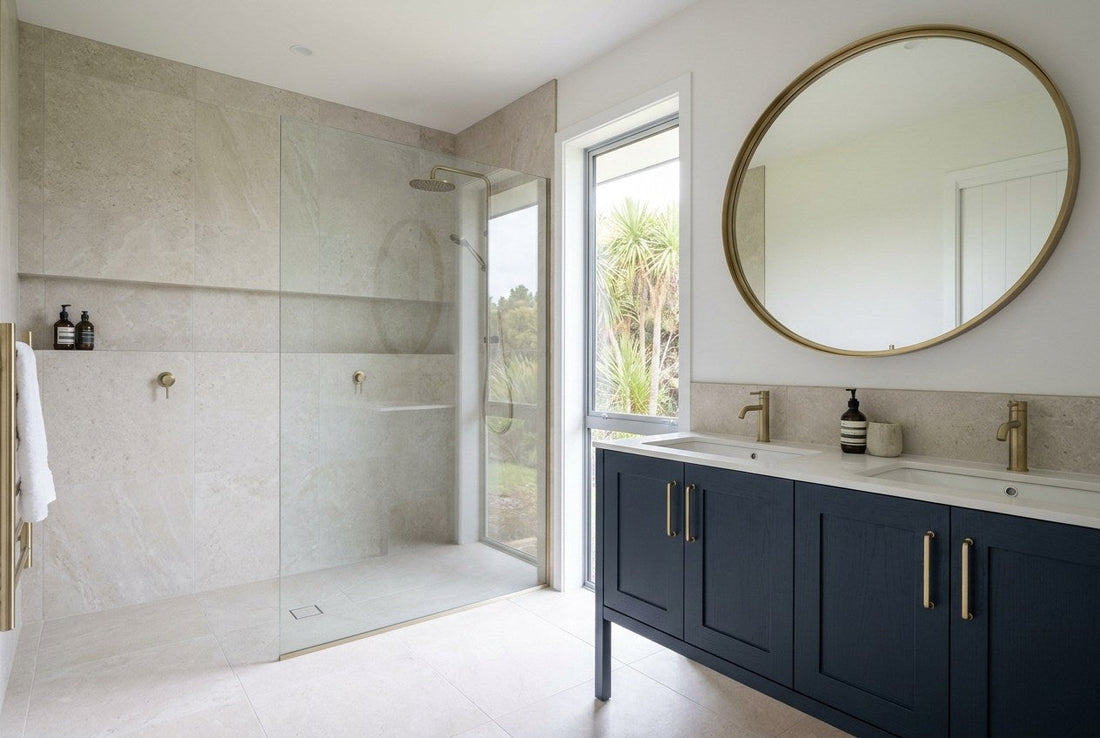A finished New Zealand bathroom with a tiled walk-in shower and a navy vanity