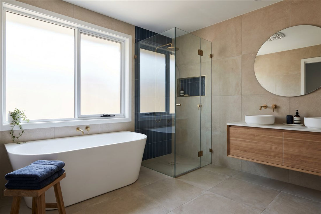 Renovated Australian family bathroom with a freestanding bath, walk-in shower and timber vanity