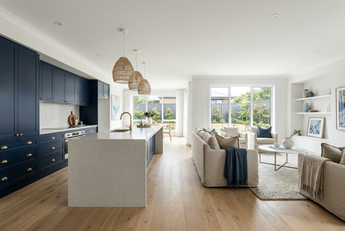 Finished modern Australian open-plan kitchen and living space with navy cabinetry and brass hardware