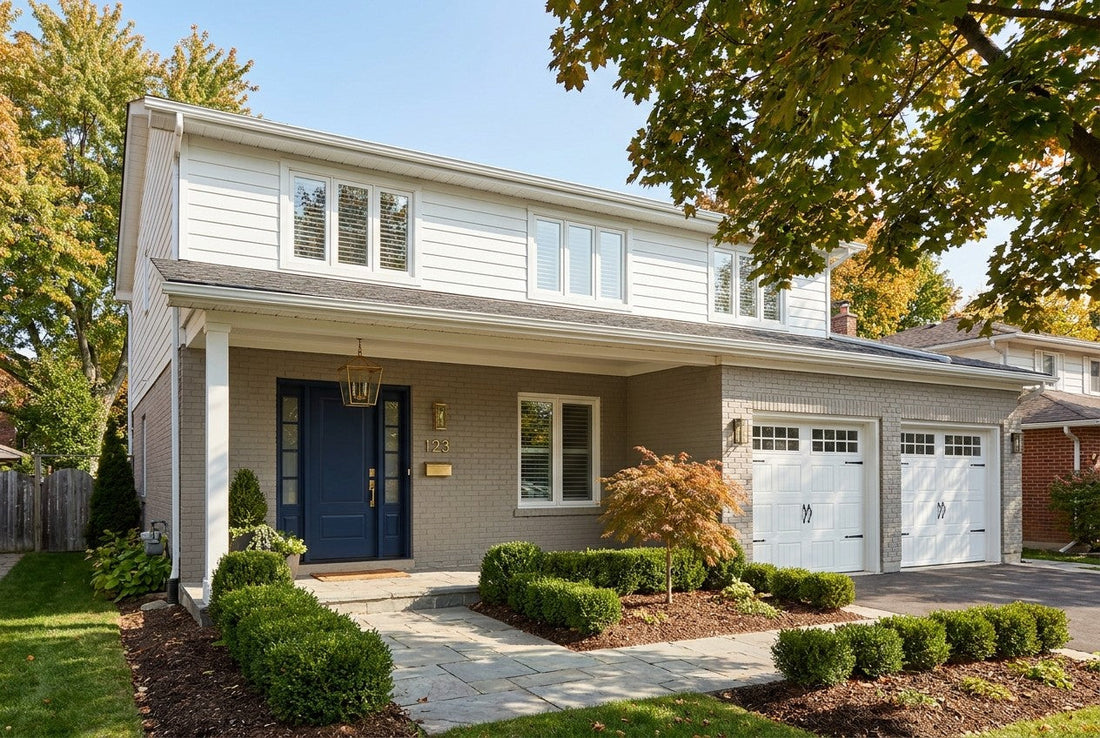 Fully renovated Canadian two-storey suburban house with navy front door, brass hardware, double garage and landscaped yard
