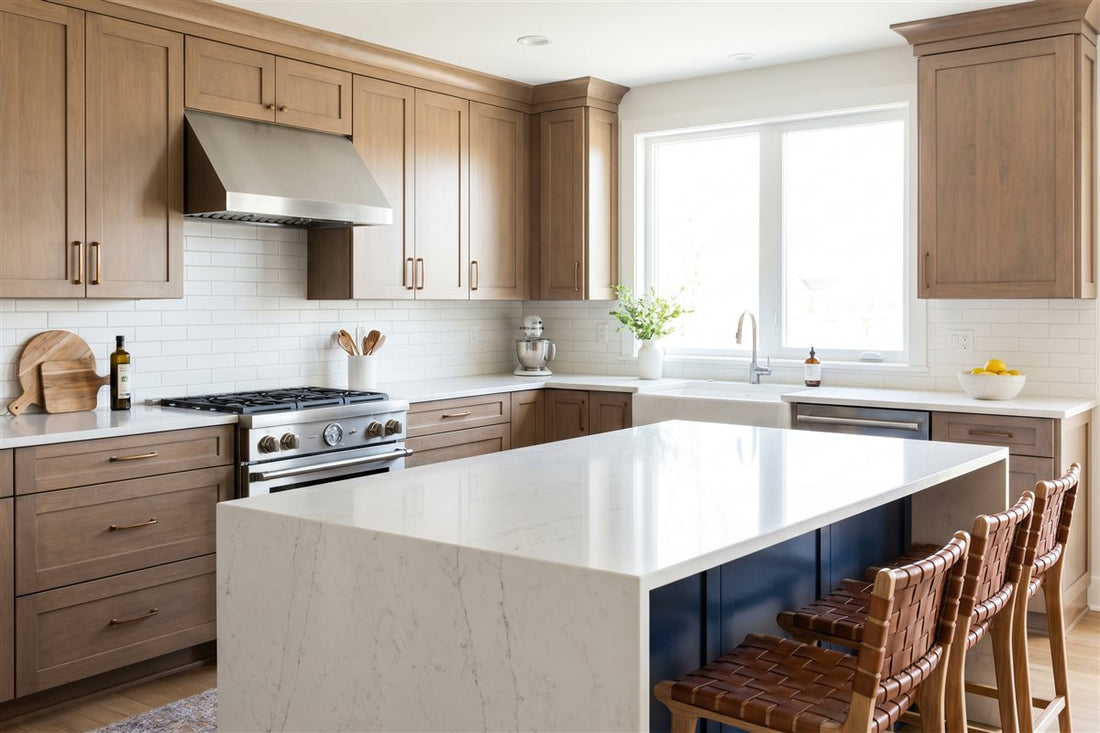 Remodeled modern American kitchen with shaker cabinetry, a quartz island and stainless steel appliances