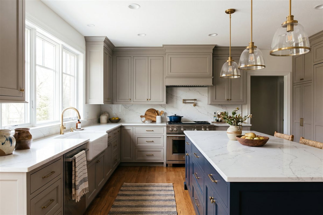 Remodeled American L-shaped kitchen with painted cabinetry, a quartz counter and farmhouse sink