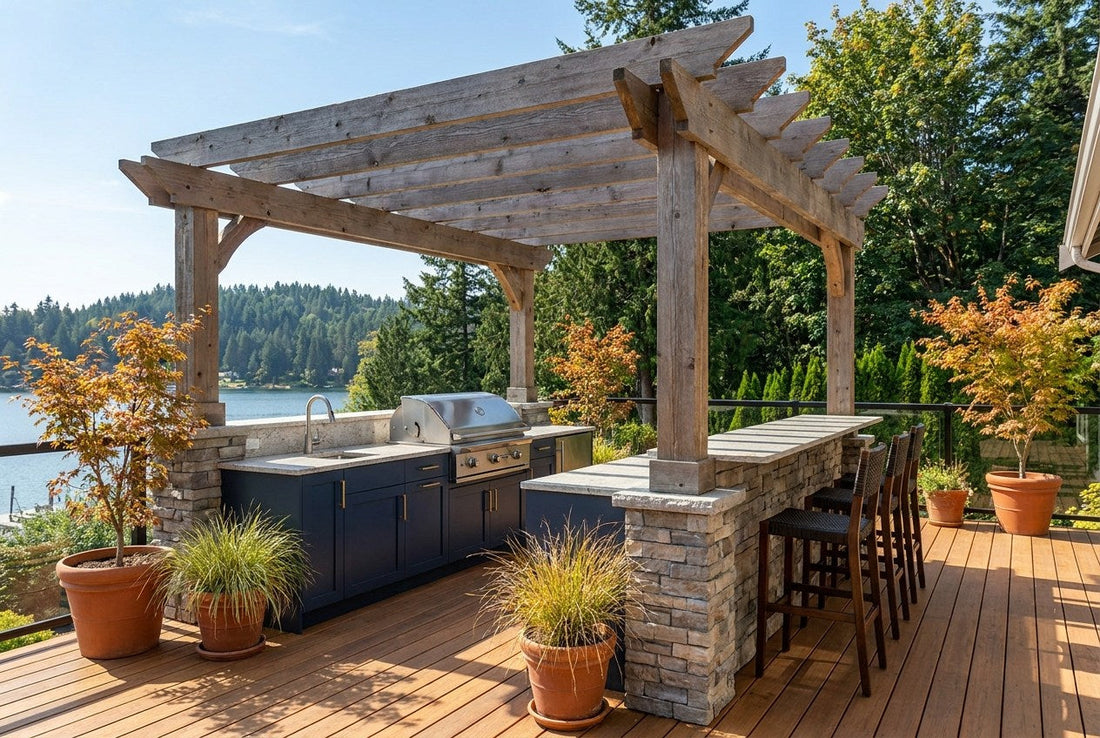 A finished outdoor kitchen on a Canadian cedar deck, with a built-in gas grill, stone counter, navy cabinetry, bar seating and a cedar pergola overlooking a lake