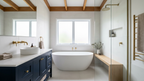 Beautifully renovated Australian bathroom with navy cabinetry and brass finishes — the result the Bathroom Renovation Blueprint helps you plan
